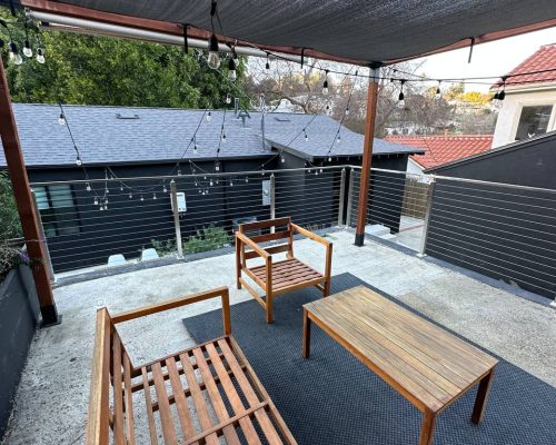 Rooftop Patio With Stainless Steel Cable Railing And Seating Area